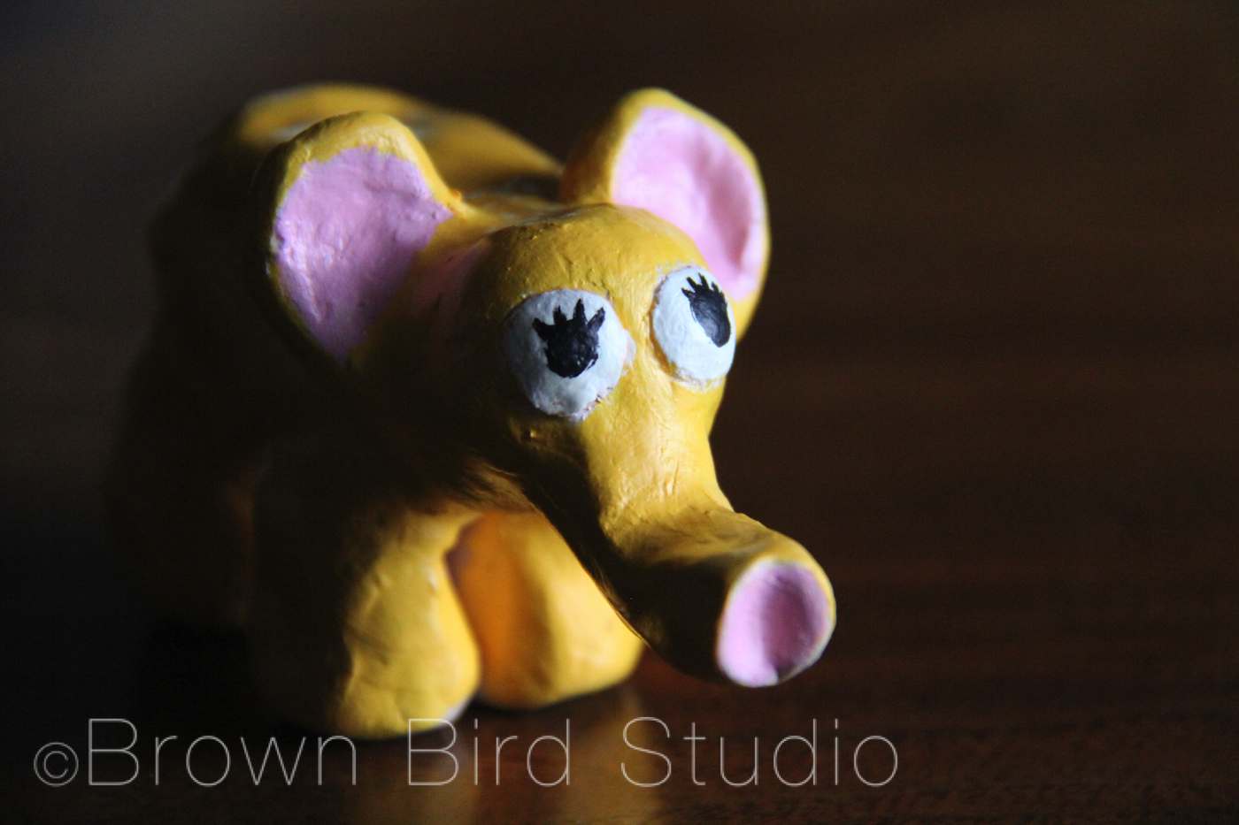 yellow ceramic elephant