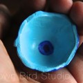 tiny blue bowl of clay painted with acrylic