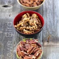 three bowls of roasted nuts