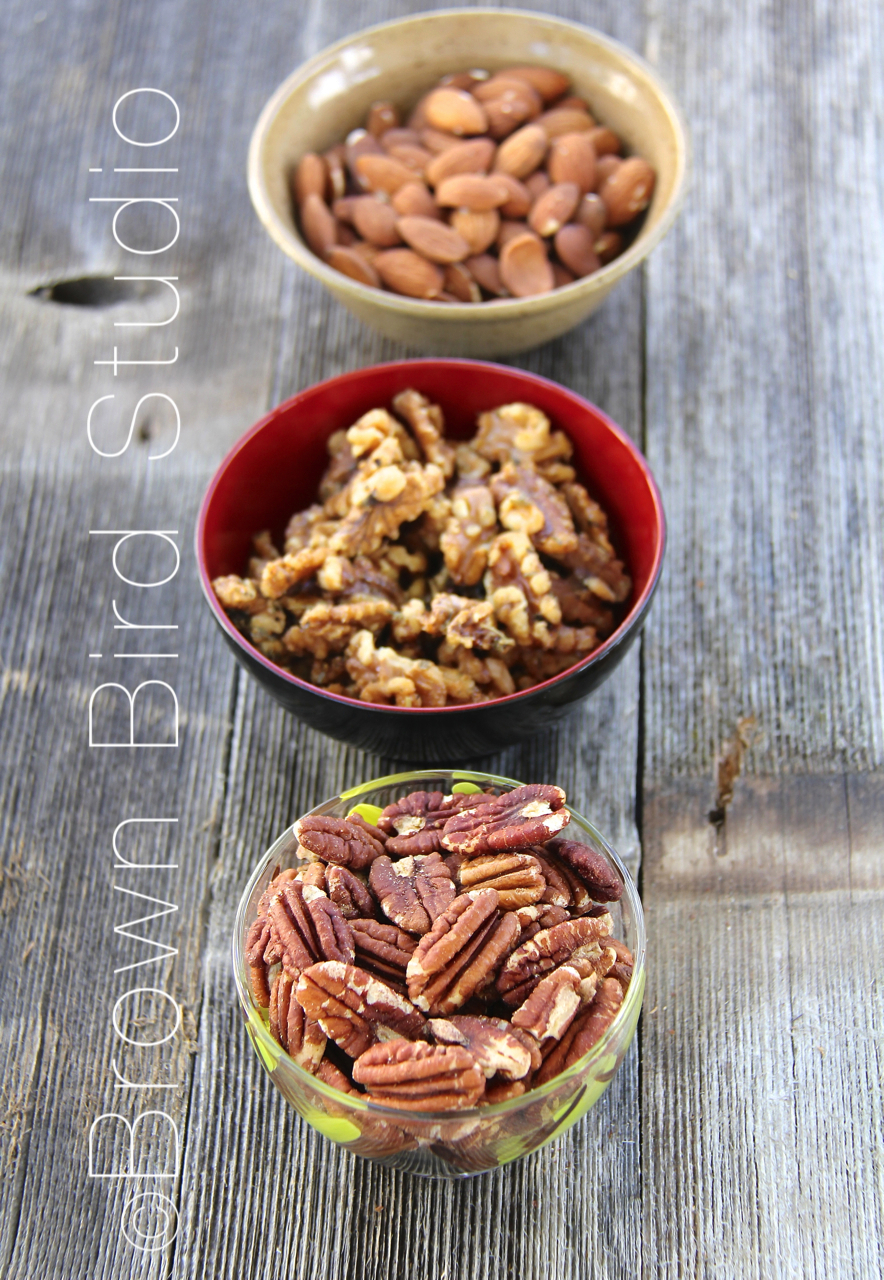 three bowls of roasted nuts